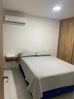 a bedroom with a bed in a room at Apartamento alameda del Rio in Barranquilla
