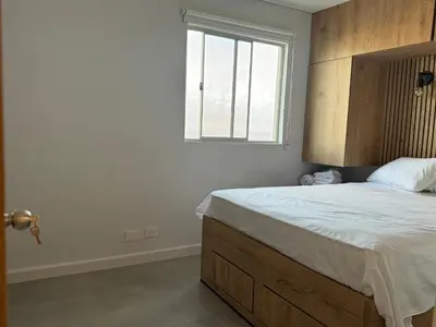 a bedroom with a large bed with a window at Oasis Vista al Mar in Cartagena de Indias