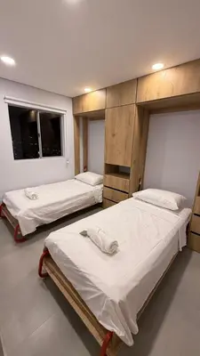 two beds in a room with at Oasis Vista al Mar in Cartagena de Indias