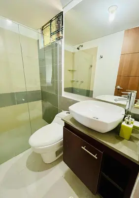 a bathroom with a white toilet and a sink at Apartamento en Sabanilla in Puerto Colombia