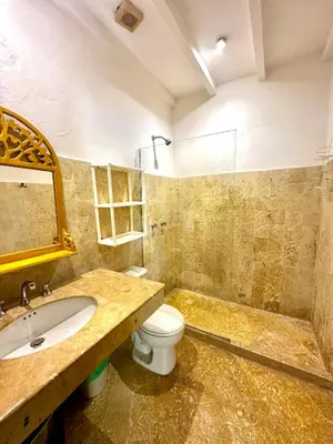 a bathroom with a sink and a toilet and a tub at by Calamari Homes - El Porvenir 306 walled city in Cartagena de Indias