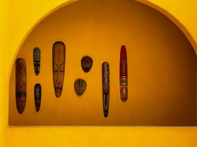 a wall with a bunch of different types of artefacts at by Calamari Homes - El Porvenir 306 walled city in Cartagena de Indias