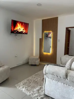 a living room with a fire on the wall at Edificio K in Cartagena de Indias
