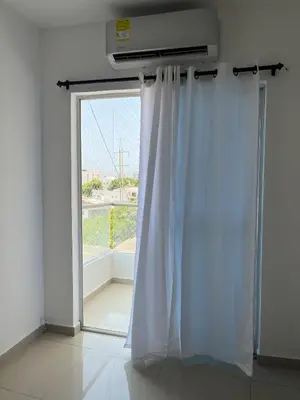 a room with a window with white curtains at Edificio K in Cartagena de Indias
