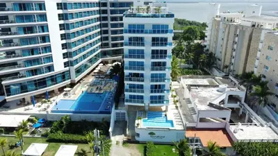 an aerial view of a tall building in a city at Aire puro frente al mar edificio sunshine in Cartagena de Indias