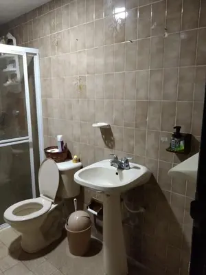 a bathroom with a toilet and a sink at Habitacion privada con servicios incluidos in Barranquilla