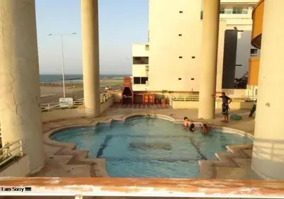 a swimming pool in the middle of a building at apartamento con vista al mar y centro histórico in Cartagena de Indias