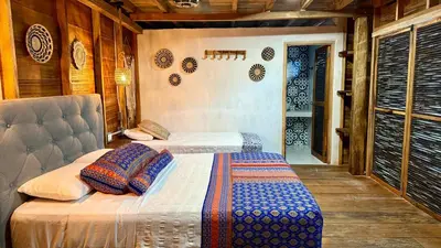 a bedroom with two beds in a room at Rincón del Mangle in San Onofre