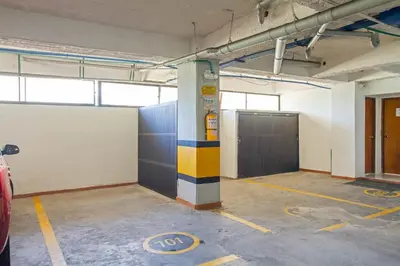 a garage with a parking lot with a garage door at Bocagrande Excelente Ubicacion Apto CONFORT con una gran vista al MAR y PLAYAS in Cartagena de Indias