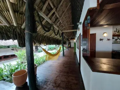 a hallway with a hammock in a building at Cabaña frente al mar en la playa del Calao in San Antero