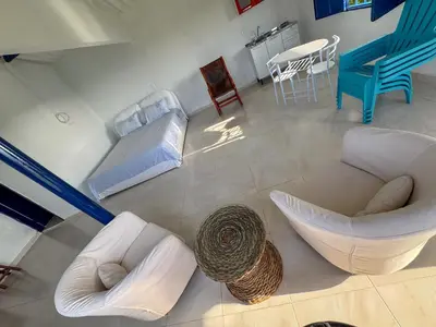an overhead view of a living room with a couch and chairs at Liz&Mar Glamping in Tubará
