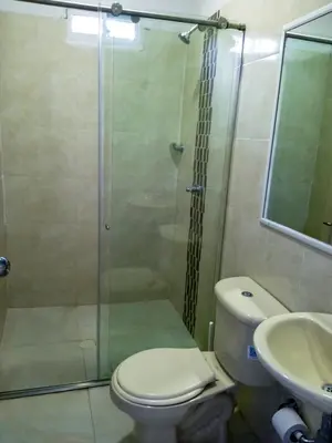 a bathroom with a shower and a toilet and a sink at Liz&Mar Glamping in Tubará