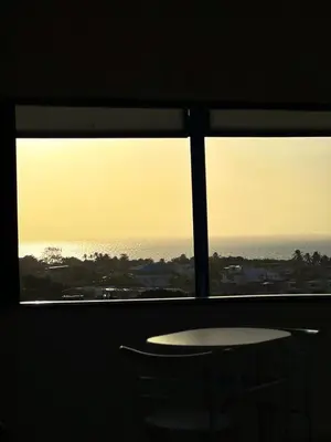 a view of the ocean from a window with a table and chairs at Liz&Mar Glamping in Tubará