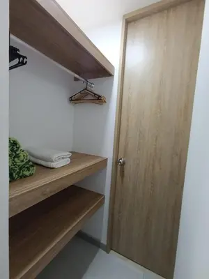 a wooden door in a room with wooden shelves at U-GO Sunset Frente al Mar in Cartagena de Indias