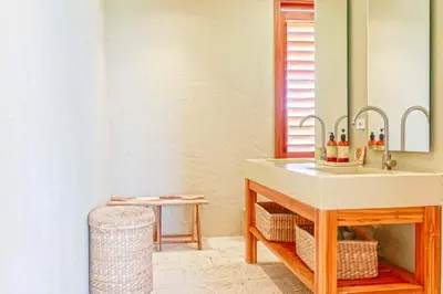 a bathroom with a sink and a mirror at Exclusive 4BR Beach House in Tierra Bomba in Tierra Bomba