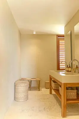 a bathroom with a sink and a table at Exclusive 4BR Beach House in Tierra Bomba in Tierra Bomba