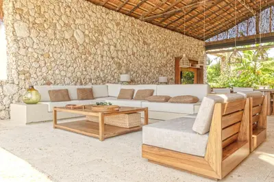 a living room with a couch and a table at Exclusive 4BR Beach House in Tierra Bomba in Tierra Bomba