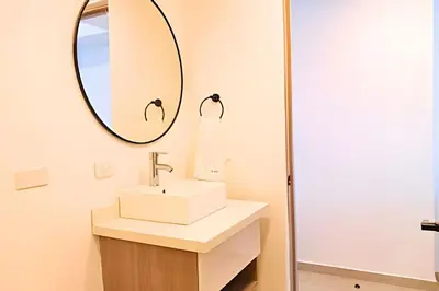 a bathroom with a sink and a mirror at Lujoso Apart Studio frente al Mar in Cartagena de Indias