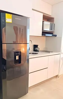 a stainless steel refrigerator in a white kitchen at Playa, Vista al mar y Comodidad, ubicación perfecta in Cartagena de Indias