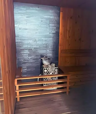 a cat sitting on top of a box in a room at Chic Apartment Near It All in Cartagena de Indias