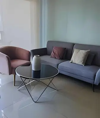 a living room with a couch and a table at Chic Apartment Near It All in Cartagena de Indias