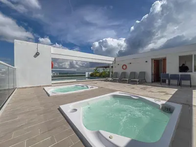 a hot tub on the patio of a house at Impresionante vista Dominique 2 suites in Cartagena de Indias