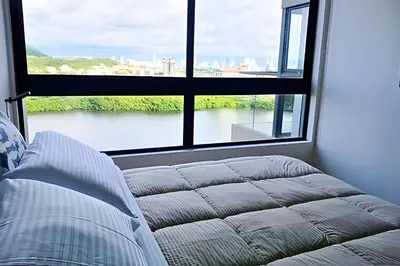 a room with a bed and a large window at Luxury 2B, stunning View 4 Blocks from walled City in Cartagena de Indias