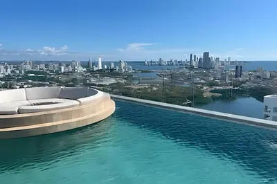 a swimming pool with a view of the city at Brand New Apt Pool & City Views in Cartagena de Indias