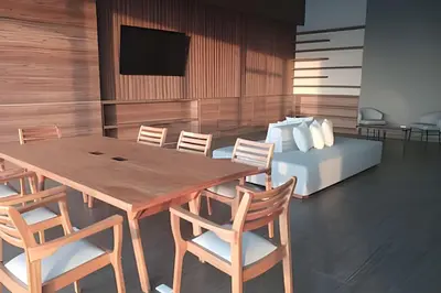 a dining room with a table and chairs and a bed at Brand New Apt Pool & City Views in Cartagena de Indias