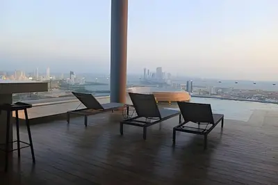 three chairs in a room with a view of a city at Stuning view to Walled city & Beach, King size bed in Cartagena de Indias