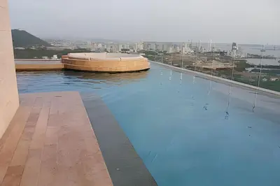 a large swimming pool on top of a building at Stuning view to Walled city & Beach, King size bed in Cartagena de Indias