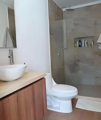 a bathroom with a toilet and a sink and a shower at Oceanfront Gem by Walled City, Spectacular Views in Cartagena de Indias