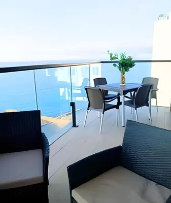 a patio with a table and chairs on a balcony at Brand New, 3blocks from Walled C, Stunning Views in Cartagena de Indias