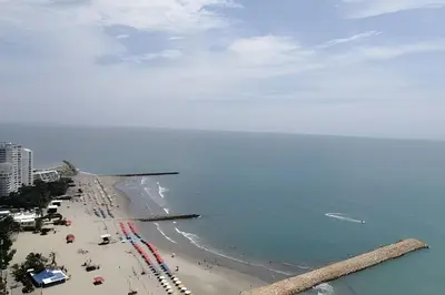 a view of a beach with people and the ocean at Luxury 2B apartment, Amazing View in Cartagena de Indias