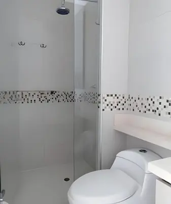 a white bathroom with a toilet and a shower at Luxury 2B apartment, Amazing View in Cartagena de Indias