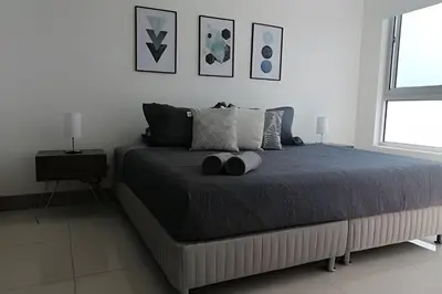 a bedroom with a large bed in a white room at Luxury 2B apartment, Amazing View in Cartagena de Indias