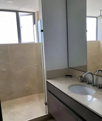 a bathroom with a sink and a mirror at Breathtaking ocean view, central location in Cartagena de Indias