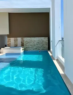 a swimming pool in the middle of a house at Charming Loft near the Beach in Cartagena de Indias