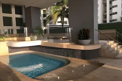 a swimming pool in the middle of a building at Coastal Charm with Mesmerizing Seaside Views in Cartagena de Indias