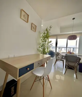 a kitchen with a desk and chairs and a dining room at Amazing Ocean View, 2B in Bocagrande in Cartagena de Indias
