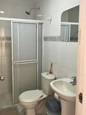a bathroom with a toilet and a sink and a shower at Bello apartamento con acceso directo a la playa in Cartagena de Indias