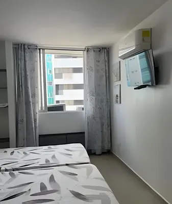 a hospital room with a bed and a window at Precioso apto en el Laguito a pasos de la playa in Cartagena de Indias
