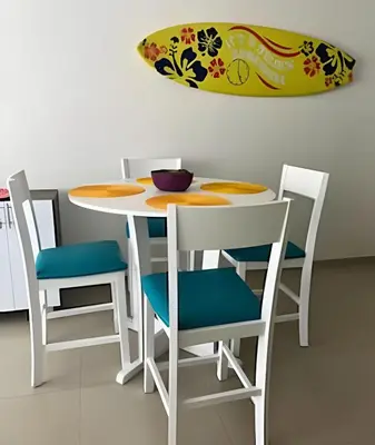 a table and chairs with a bowl on top of it at Precioso apto en el Laguito a pasos de la playa in Cartagena de Indias
