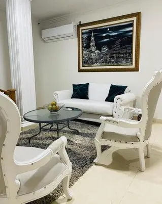 a living room with a couch and a table and chairs at Casa lujosa cerca al mar en cartagena in Cartagena de Indias