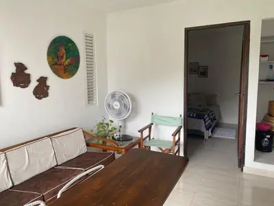 a living room with a couch and a fan at Northwest Hostings 4 in Cartagena de Indias