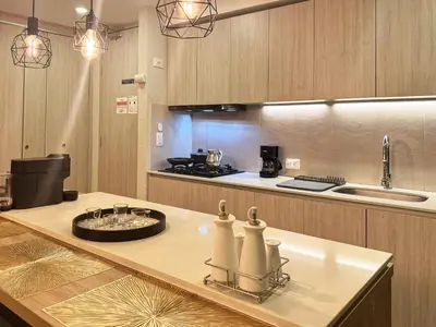 a kitchen with a counter top with a sink and a counter sidx sidx at Dominique Luxury - 1 BR - Private Jacuzzi - 13th Floor in Cartagena de Indias