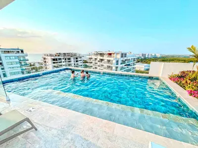 a swimming pool on top of a building at Dominique Luxury - 1 BR - Private Jacuzzi - 13th Floor in Cartagena de Indias