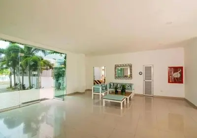 a large living room with a couch and chairs at Apto De 3 Hab con Vista y Salida directa Al Mar in Estación El Salto