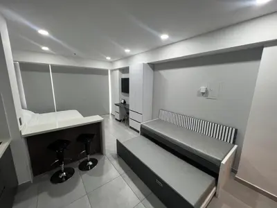 a room with a bed and a desk in it at Apartasuite en Cartagena in Cartagena de Indias