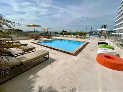 a swimming pool on top of a building at Apartasuite en Cartagena in Cartagena de Indias